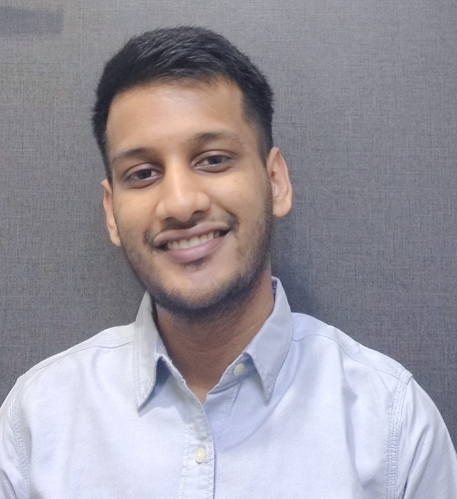 A picture of Dhruv smiling